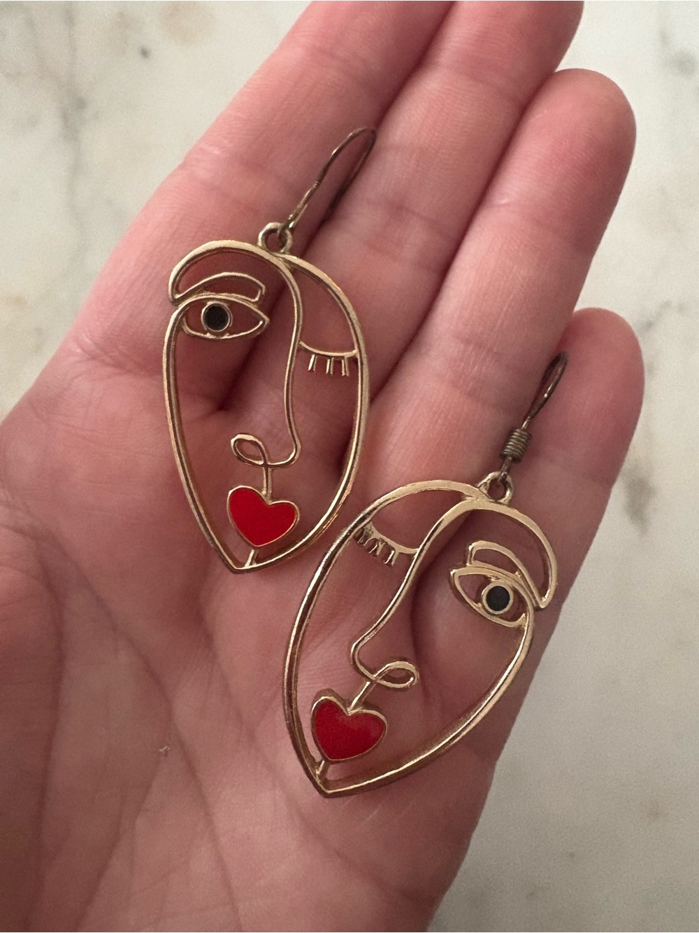 Gold Abstract Face Drop Earrings with Red Heart Accent